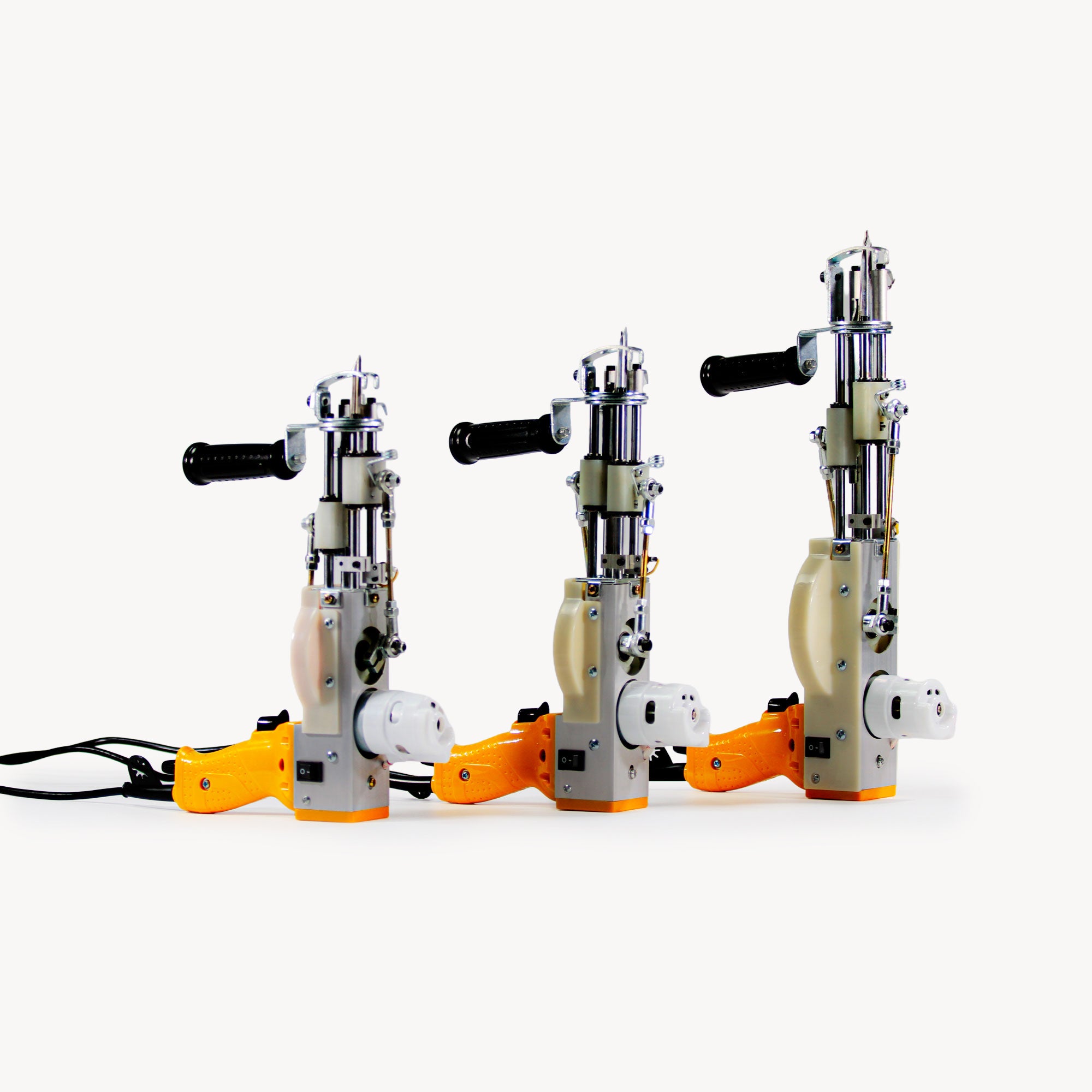 Three yellow AK DUO tufting machines – standard and high pile models for 10–40 mm rug tufting